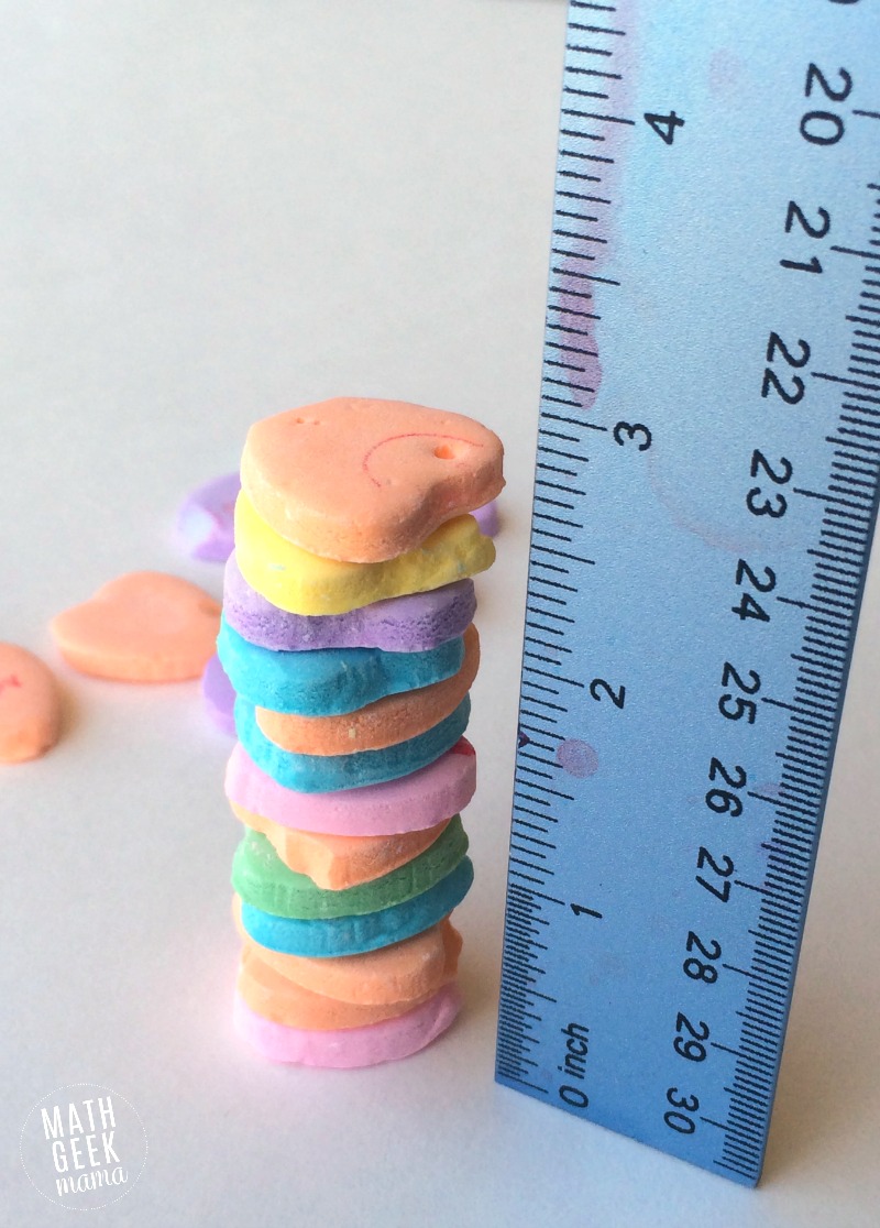 This simple challenge lets kids explore engineering and math, as well as work on fine motor skills! All you need is a bag of conversation hearts for hours of math fun and learning!