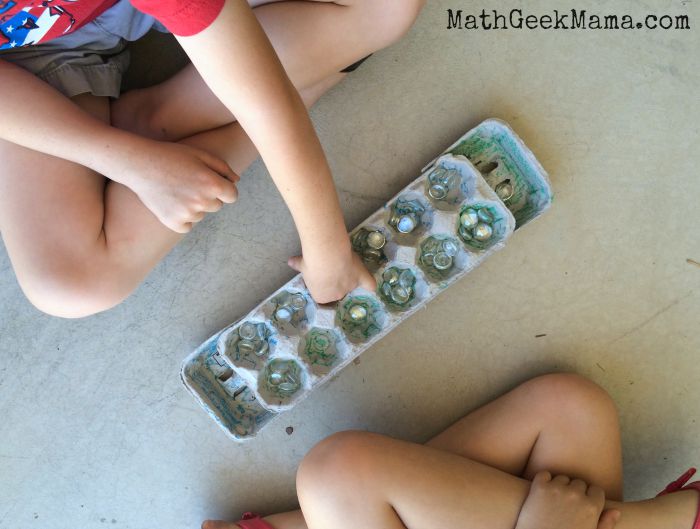Create your own Mancala game out of an egg carton! A great way for kids to learn math and strategy through play! 