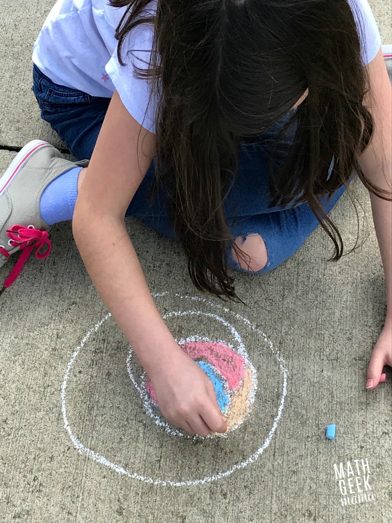 Looking for a fun, yet super simple way to engage your kids this Pi Day? This Pi Day art project is just as fun with paper and colored pencils as it is with sidewalk chalk! Learn more and get a free printable recording page in the full post!